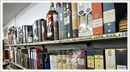 expensive bourbon cognac wine bottles gift wrapped in gift boxes